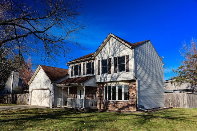 view of front of house featuring a garage, a porch, and a front lawn