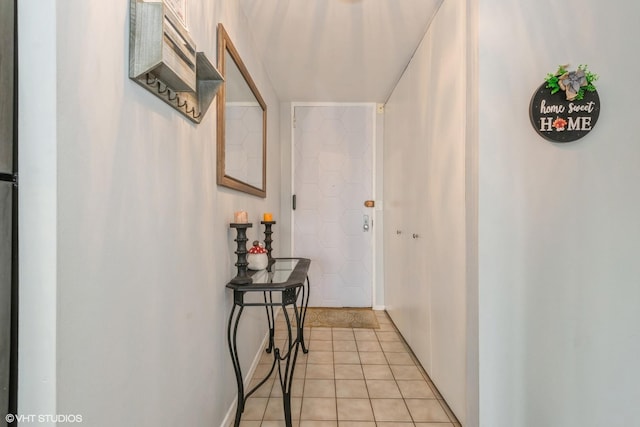 hallway featuring light tile patterned floors