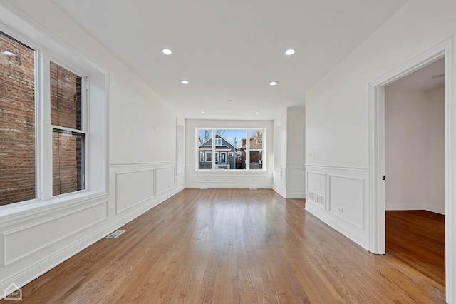 spare room featuring light wood-type flooring