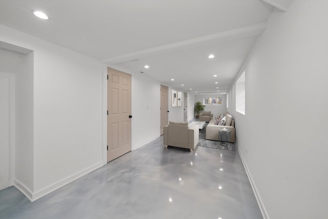 unfurnished living room featuring concrete flooring