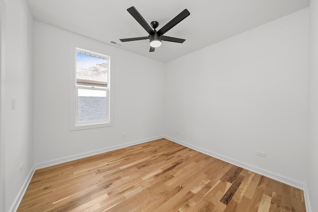 spare room with hardwood / wood-style floors