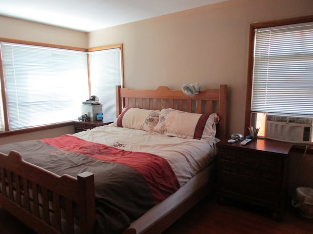 bedroom featuring dark hardwood / wood-style flooring