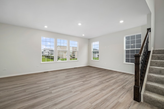 unfurnished living room featuring light hardwood / wood-style floors