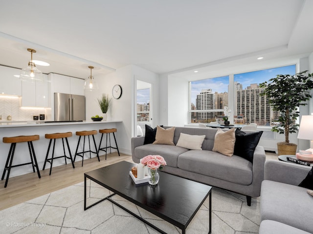 living room with light hardwood / wood-style flooring