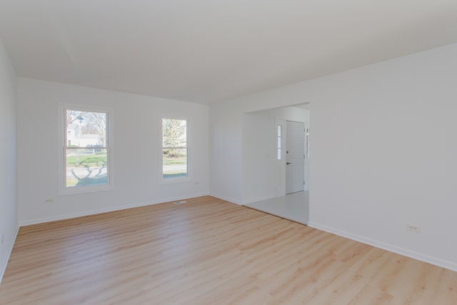 unfurnished room featuring light hardwood / wood-style flooring