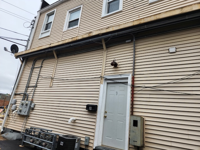 doorway to property featuring central air condition unit