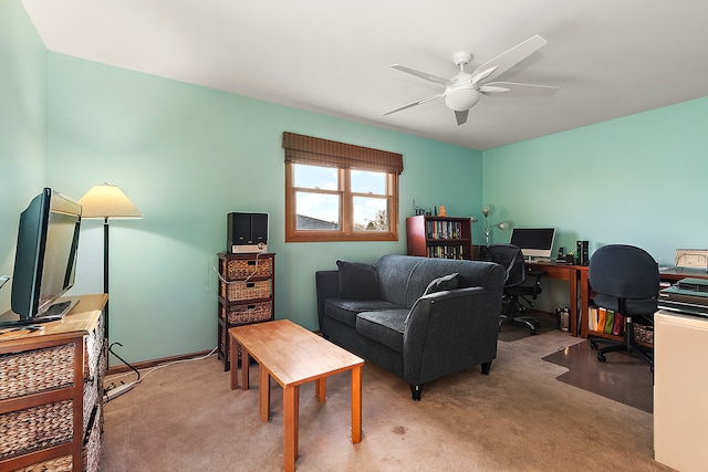 home office featuring ceiling fan and light colored carpet