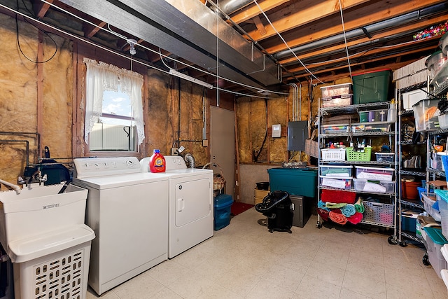 laundry room featuring washer and clothes dryer and electric panel