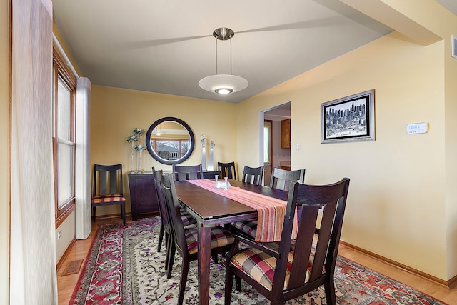 dining area with light hardwood / wood-style floors