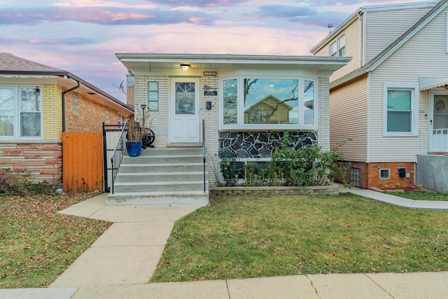 view of front of house with a lawn