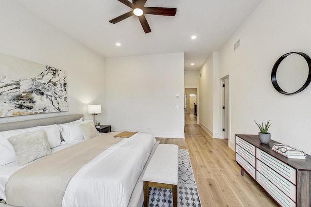 bedroom with ceiling fan and light wood-type flooring