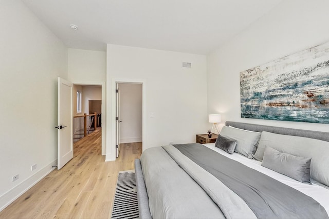 bedroom with light hardwood / wood-style flooring