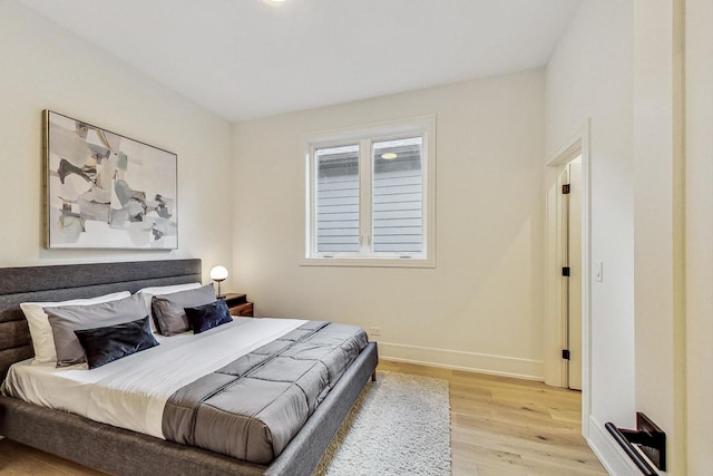 bedroom with light hardwood / wood-style floors