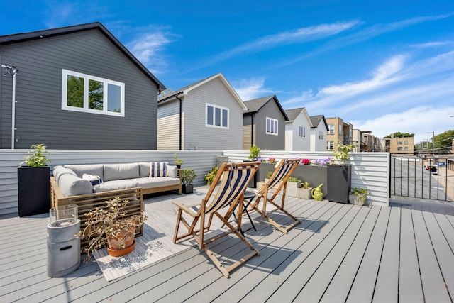 wooden terrace featuring an outdoor hangout area