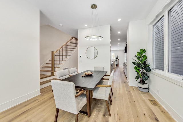 dining room with light hardwood / wood-style flooring