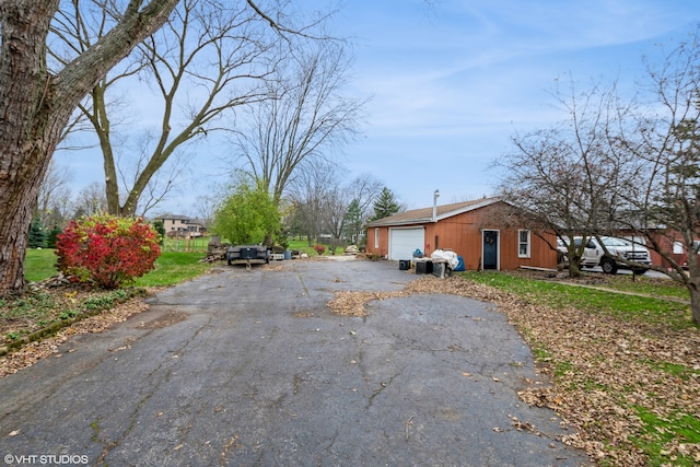 view of property exterior featuring a garage