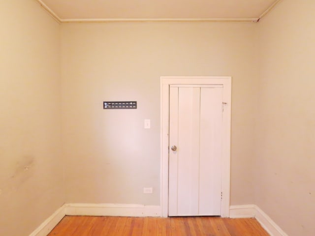 spare room featuring hardwood / wood-style flooring