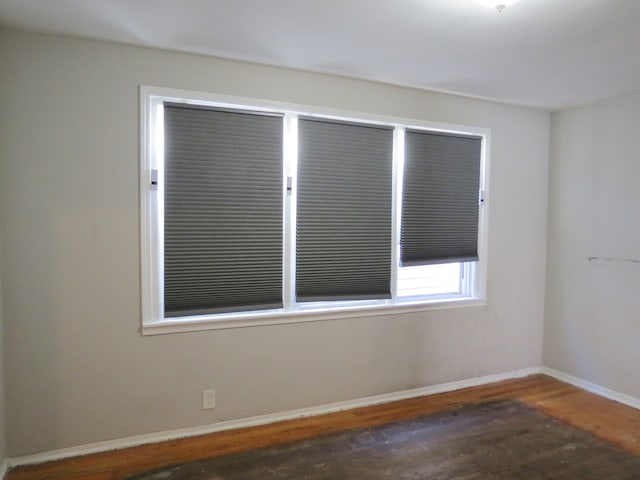 empty room featuring dark hardwood / wood-style floors