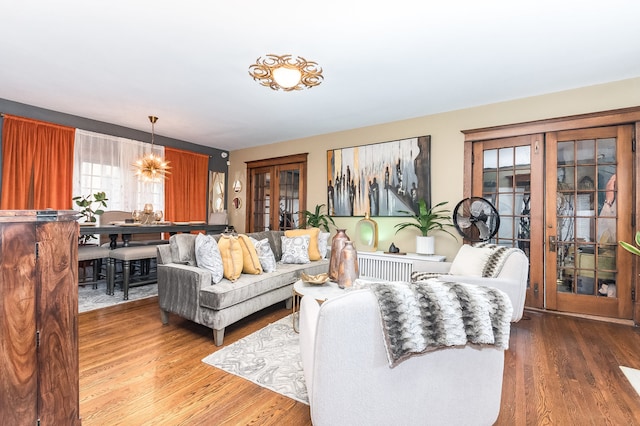 living room featuring hardwood / wood-style floors and french doors