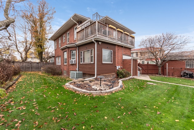 view of property exterior featuring a lawn, a balcony, and cooling unit