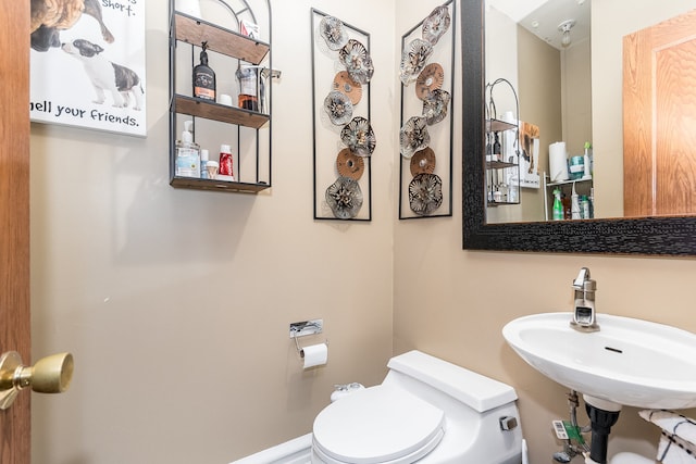 bathroom with toilet and sink