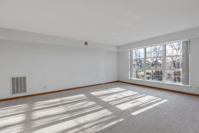 unfurnished room with light colored carpet