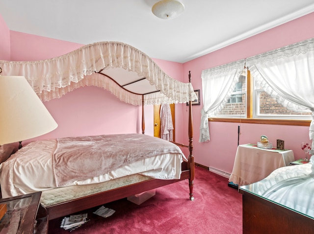 carpeted bedroom featuring baseboard heating