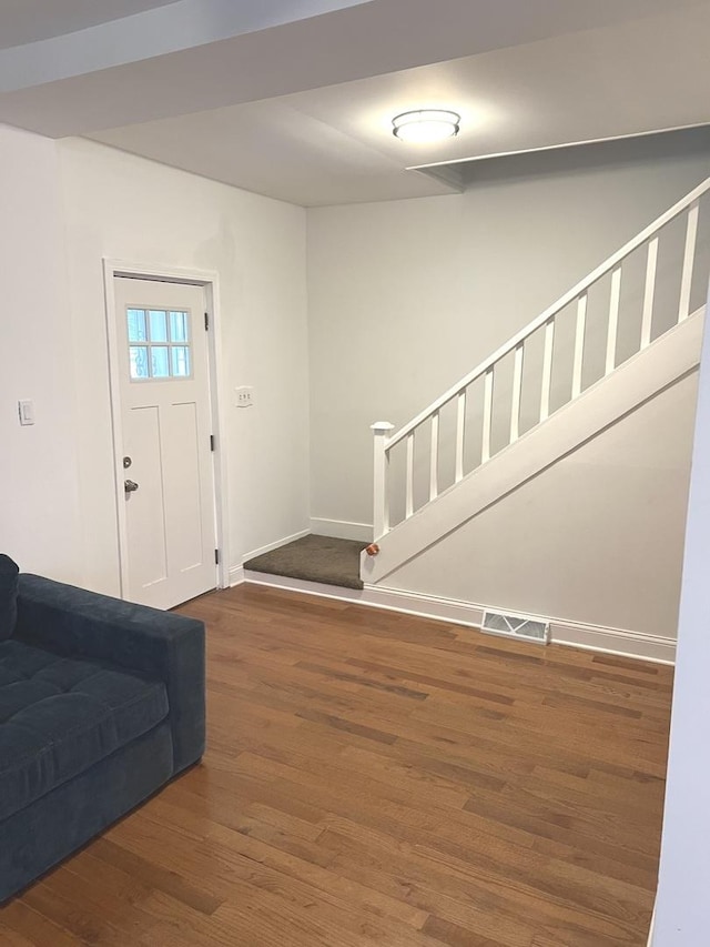 foyer entrance featuring dark hardwood / wood-style floors