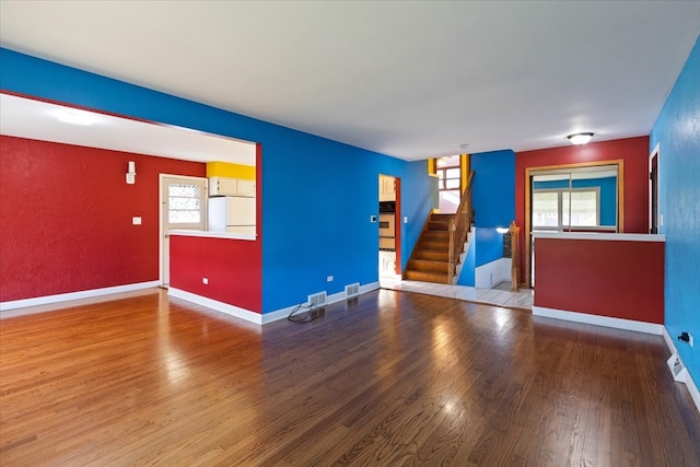 empty room with light hardwood / wood-style floors