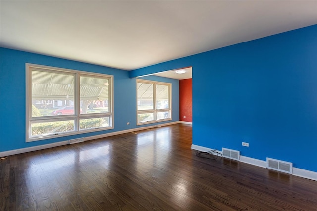 unfurnished room featuring dark hardwood / wood-style flooring