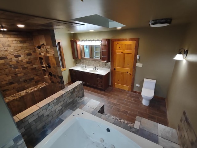 full bathroom featuring toilet, shower with separate bathtub, backsplash, and vanity