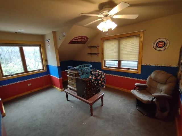 living area with ceiling fan and carpet floors