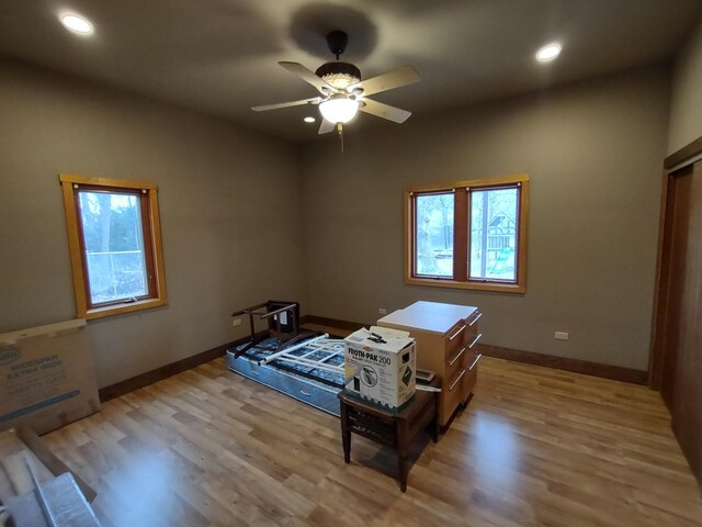 bedroom featuring ceiling fan and light hardwood / wood-style flooring