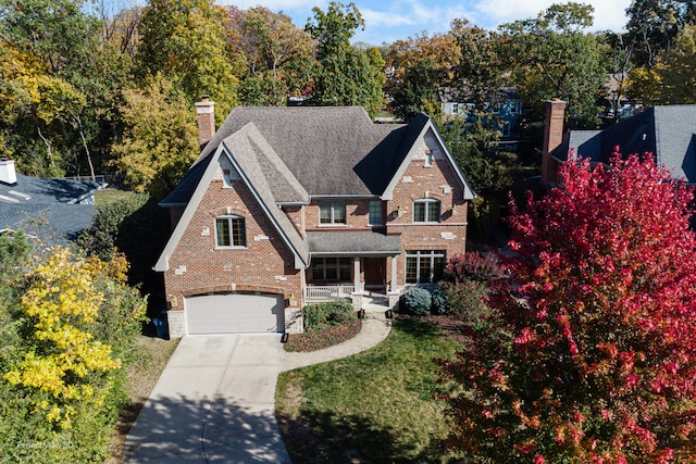 view of front of home with a porch and a garage