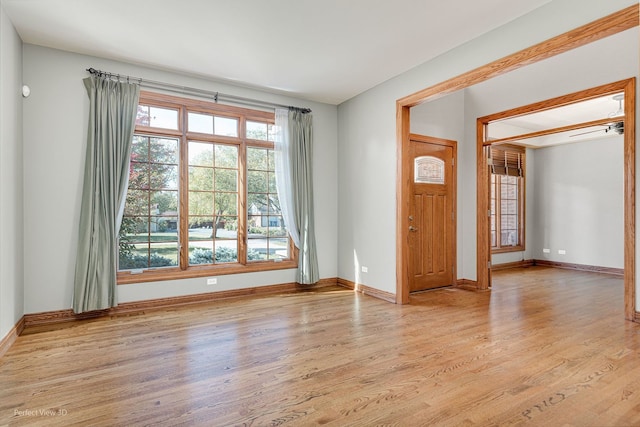 unfurnished room featuring light hardwood / wood-style floors