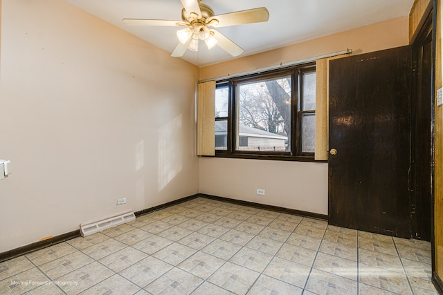 spare room with ceiling fan