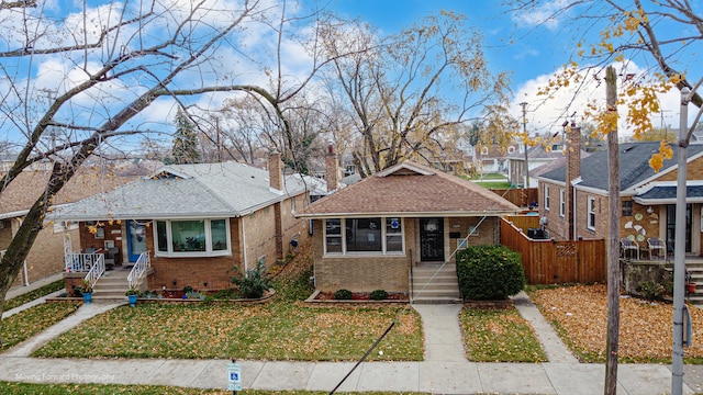 bungalow-style house with a front yard