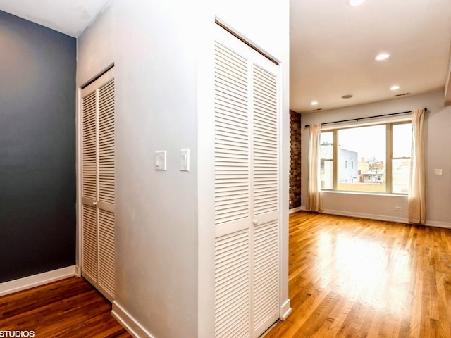 hall with wood-type flooring