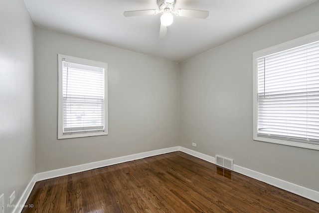 unfurnished room featuring dark hardwood / wood-style floors and ceiling fan