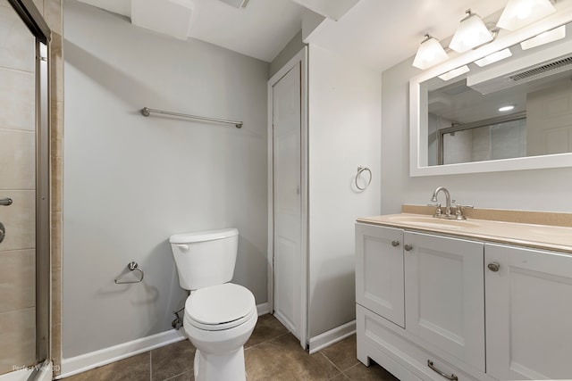 bathroom with walk in shower, tile patterned flooring, vanity, and toilet