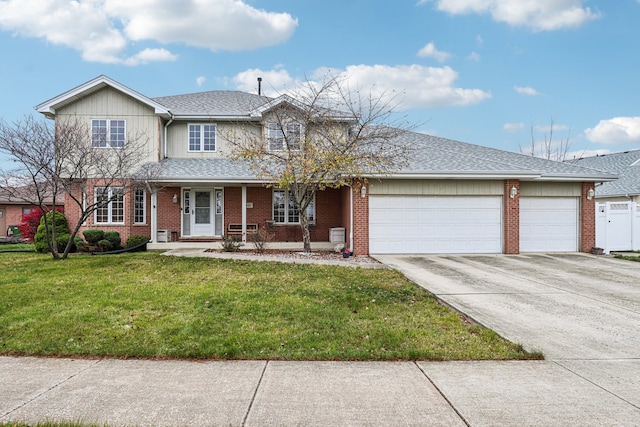 view of front of house with a garage and a front lawn