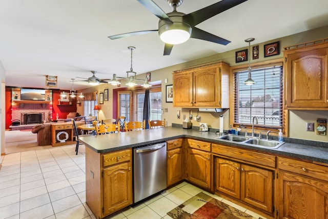 kitchen featuring pendant lighting, dishwasher, sink, plenty of natural light, and kitchen peninsula