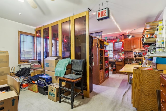 interior space with ceiling fan