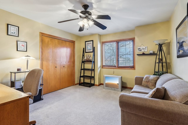 carpeted office with ceiling fan