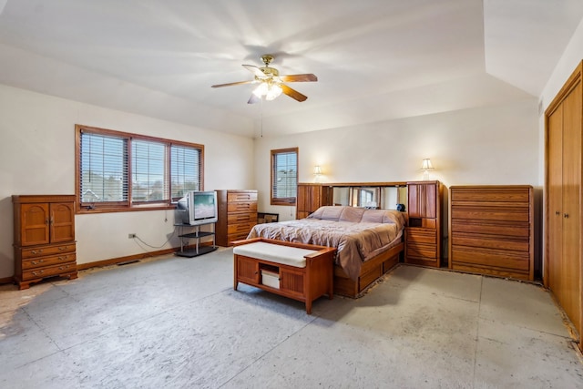 bedroom with ceiling fan and a closet