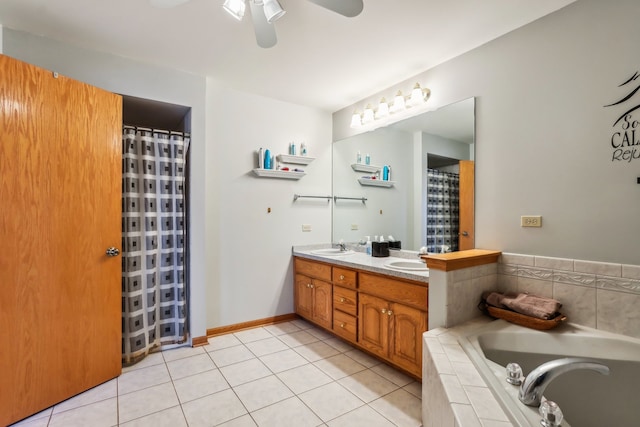 bathroom featuring vanity, ceiling fan, tile patterned flooring, and a relaxing tiled tub