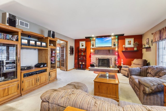 living room with a fireplace and light carpet