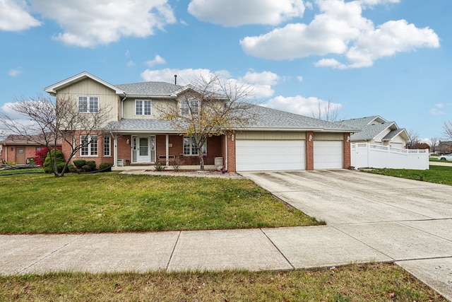 view of front facade featuring covered porch, a garage, and a front lawn