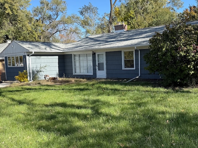 ranch-style house with a front lawn