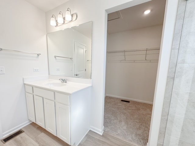 bathroom featuring hardwood / wood-style floors and vanity